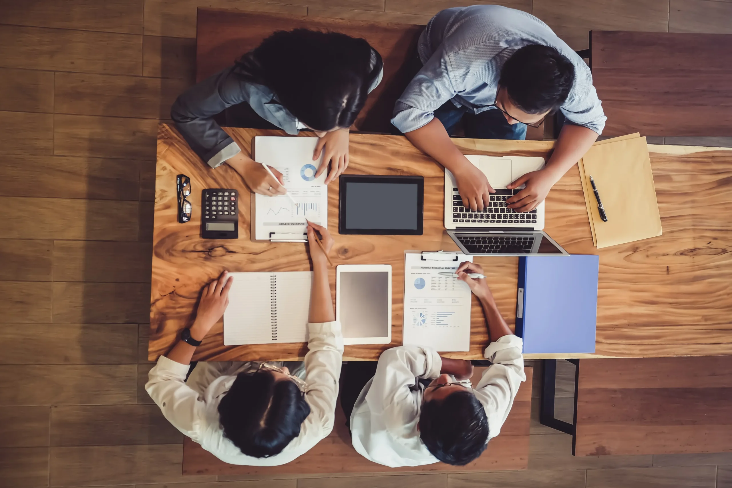 business people sitting around a desk